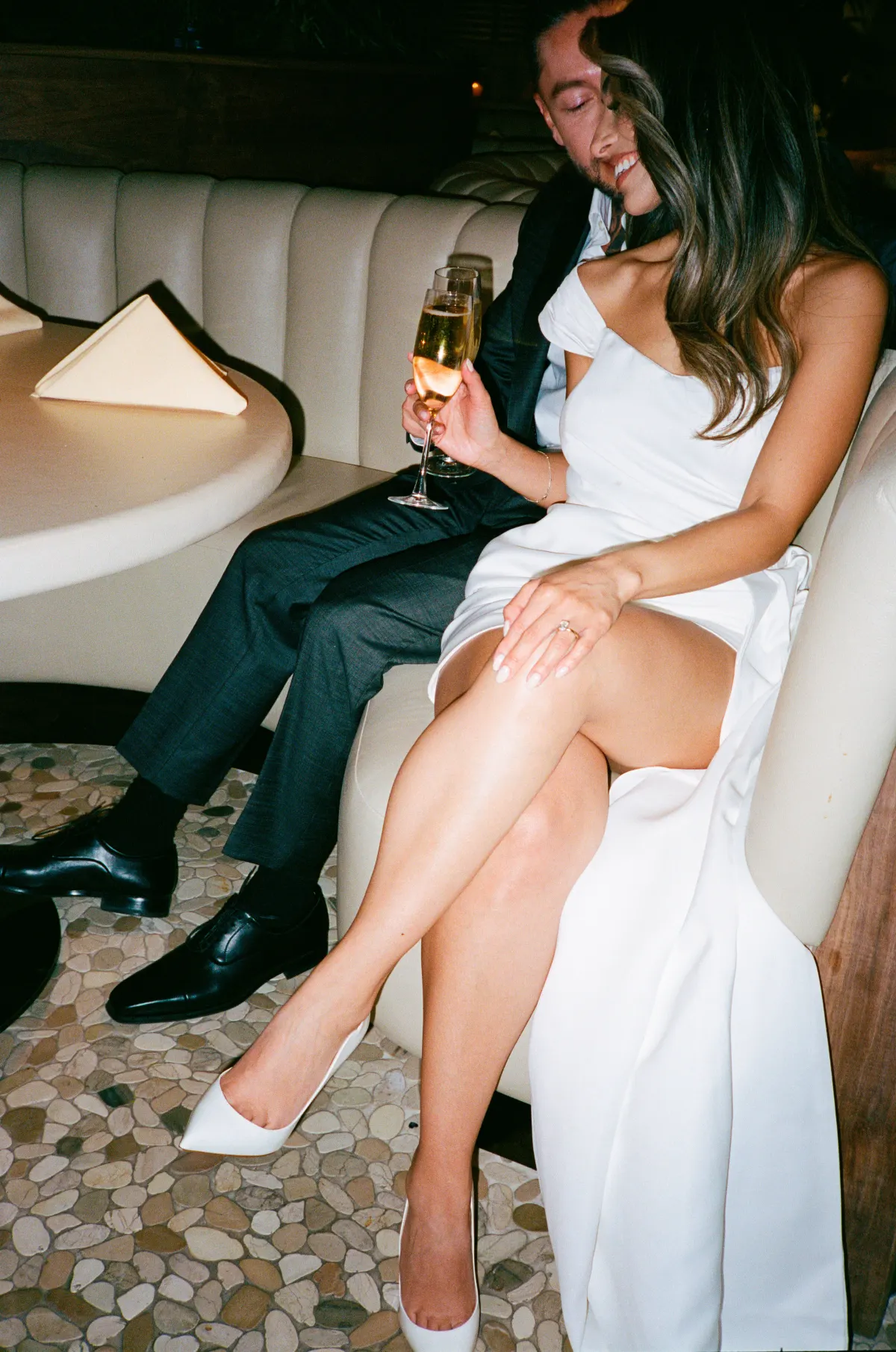 Late-night reception champagne — soft, low-light Super 8 still
